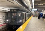 Northbound NYCTA Holiday Train Set of Arnine Cars at 86th St Station on the Q Line 